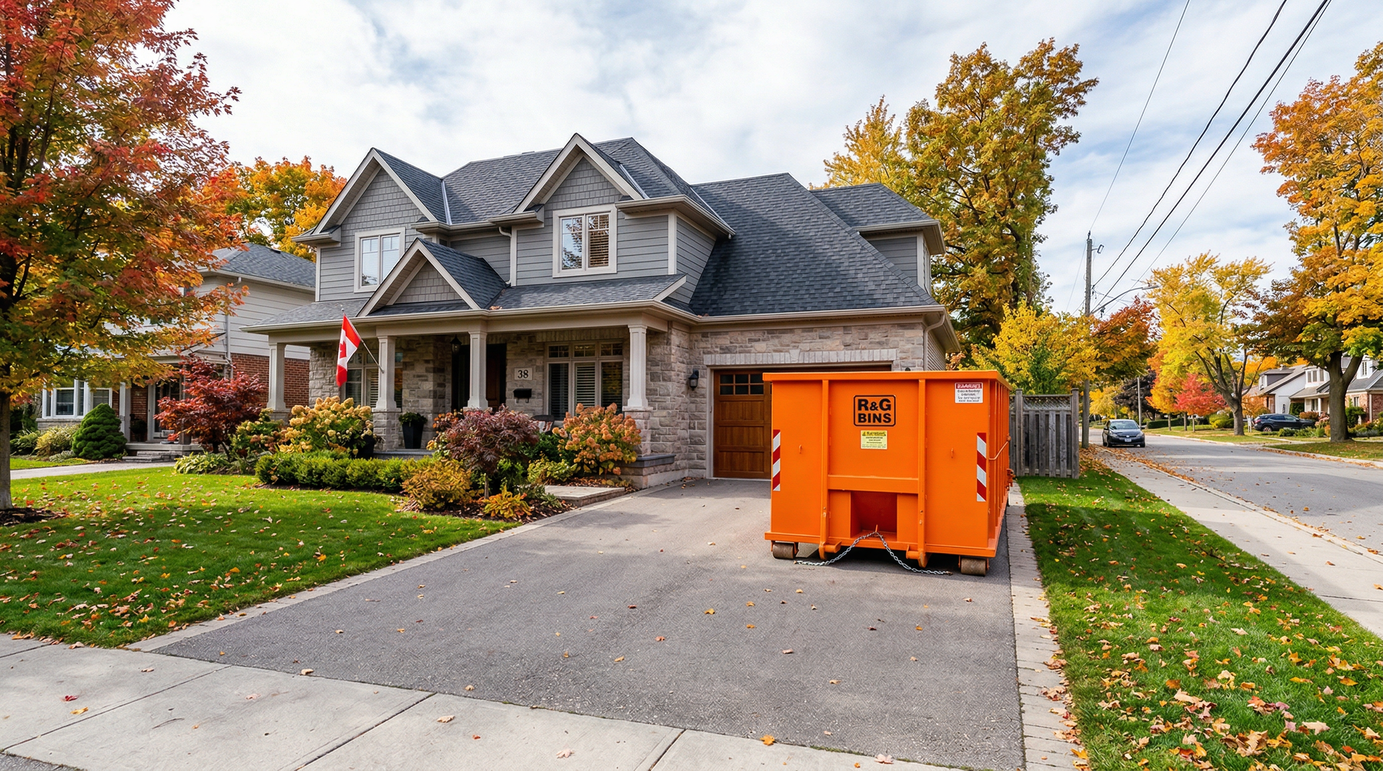 Orange disposal bin in Canadian residential driveway